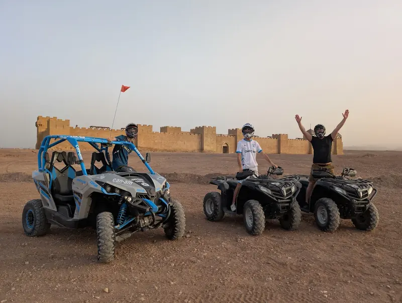 A buggy and quads in front of the Kingdom of Heaven film set