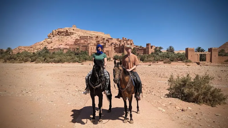 Riders and horses at the foot of Ait Ben Haddou