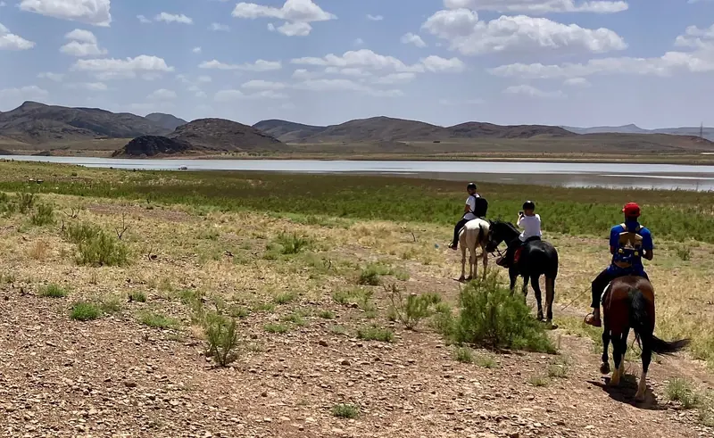 Riders near the lake of Ouarzazate