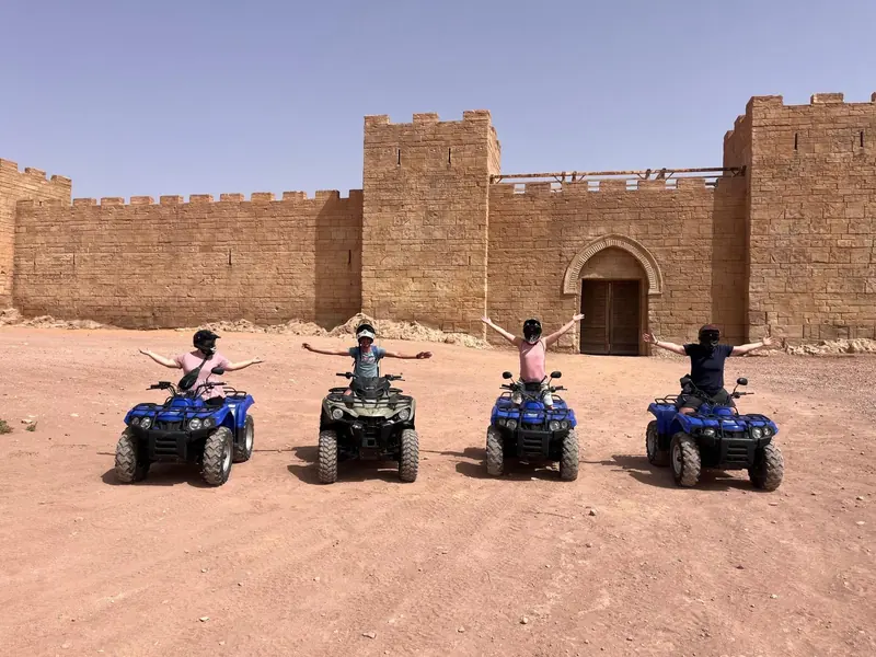 Four quads lined up in front of the Kingdom of Heaven film set fortress