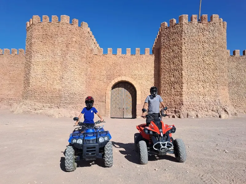 Blue and red quads in front of the Kingdom of Heaven fortress